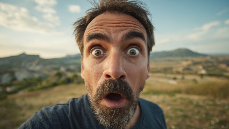 a-man-looking-surprised-expressive-face-with-wide-.jpeg